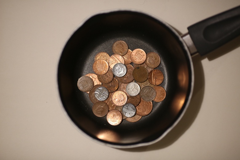 Pan with coins in